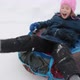 A cheerful happy girl on snow tube - VideoHive Item for Sale
