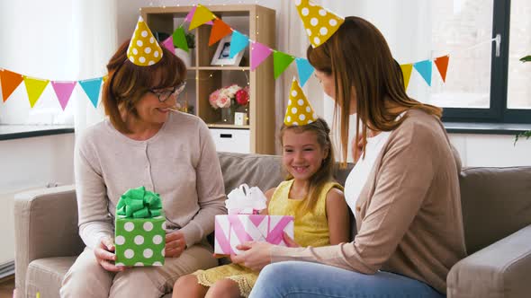 Family Greeting Girl with Birthday at Home Party