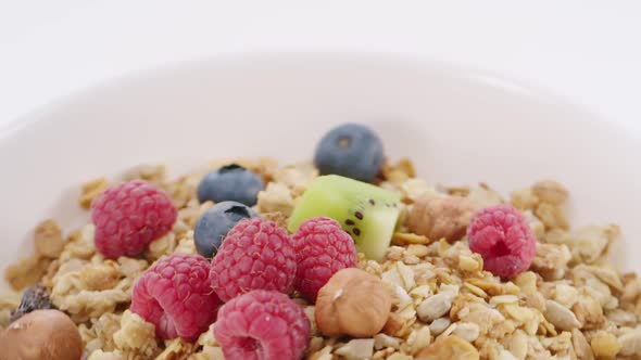 Milk and Muesli Throwing Into the Bowl with Healthy Breakfast