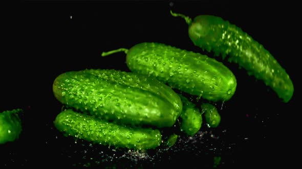 Super Slow Motion Cucumbers Fall on the Water with Splashes