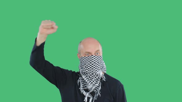 Protester Man in Checkered Bandana at Demonstration on Green Chroma Key Background. Bald Man with