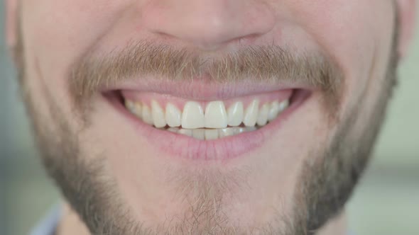 Close Up of Smiling Mouth of Young Creative Man
