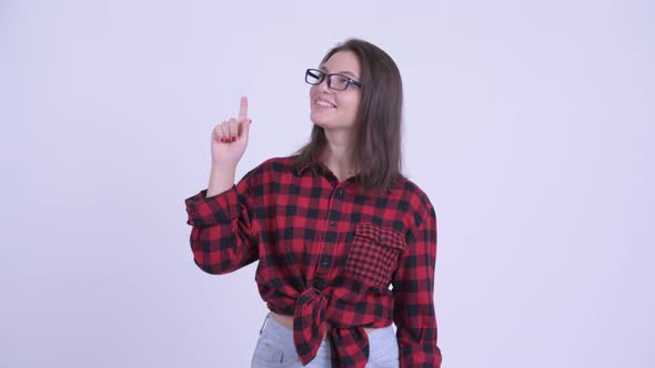 Happy Young Beautiful Hipster Woman Pointing Up