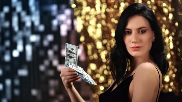 Seductive Woman Cash Dollar Money at Silver Golden Sparkle Bokeh