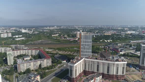 Aerial view of new modern high-rise buildings and old panel houses 07