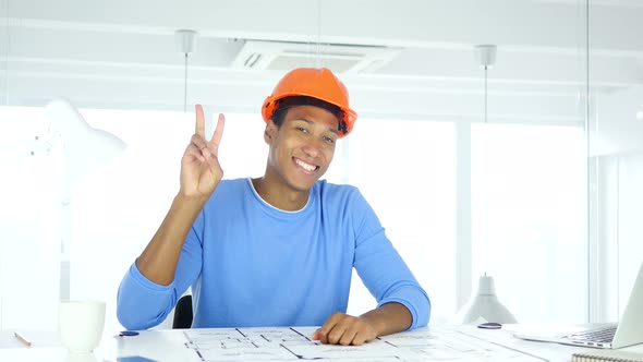 Victory Sign by Afro-American Architectural Engineer at Work