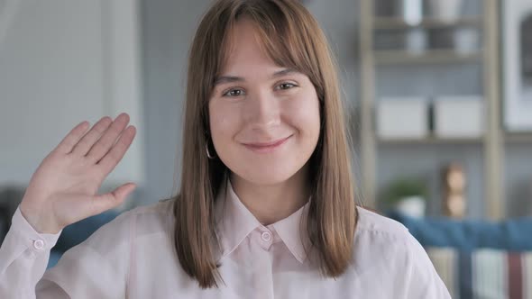 Casual Young Girl Waving Hand to Welcome