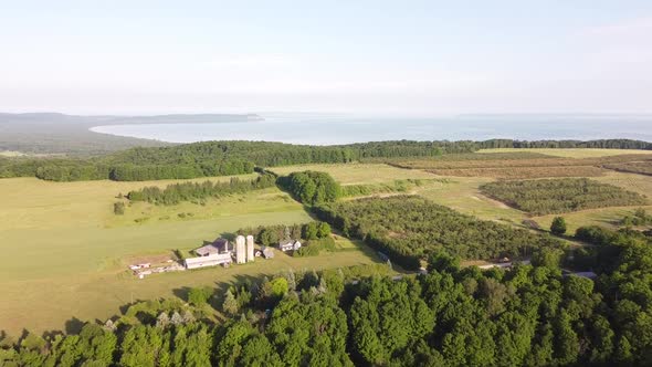 Scenic View Of The Lush Cherry Orchard With Pyramid Point In The Background At The Sleeping Bear Dun