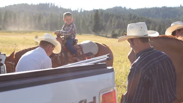 Cowboys take break from herding cattle