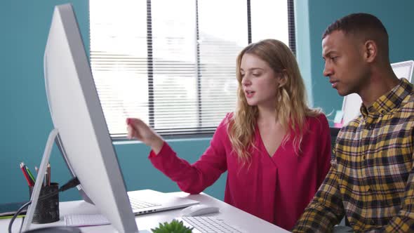 Man and woman looking at the computer