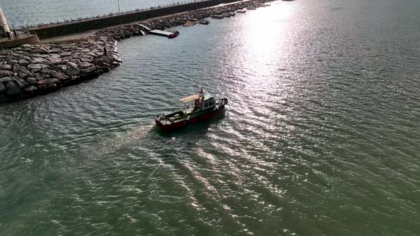 Ship tug sails out of port aerial view Turkey Alanya 4 K