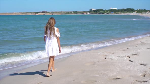 Adorable Little Girl at Beach During Summer Vacation