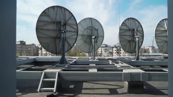 Industrial Satellite Dishes on the Roof of a Building