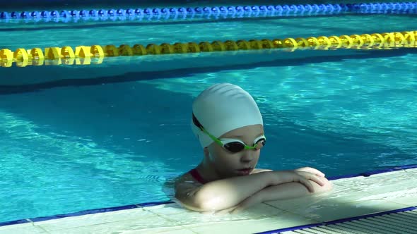 Teenager Girl Face in Swimming Pool. Close Up of Woman Portrait Smiling in Resort Pool Water.