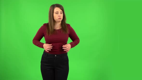 Pretty Girl Cooling Herself By Her Hand, Suffering From High Temperature Weather. Green Screen