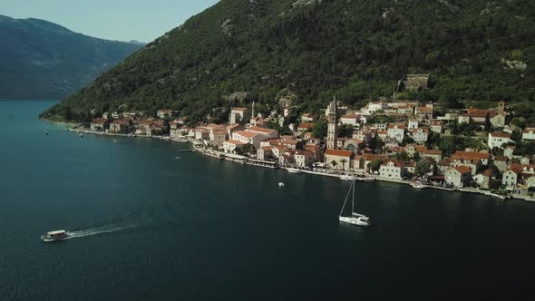 Aerial view of city Perast in Montenegro. Flying over the Kotor Bay and mountains