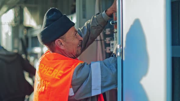 Engineer repairing electricity box