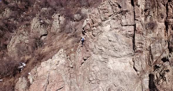 A Group of People are Engaged in Rock Climbing