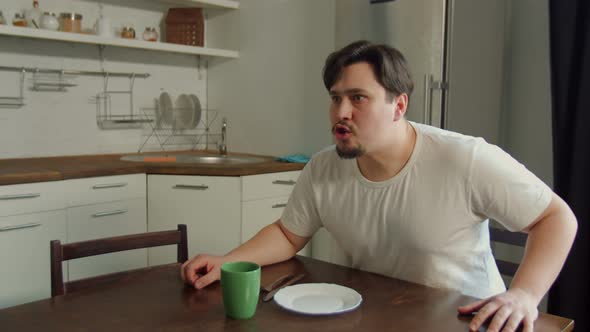 Angry Man Screaming, Threatening Woman in Kitchen