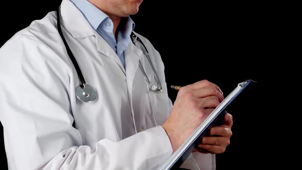 Cropped View of Doctor Writing on Clipboard