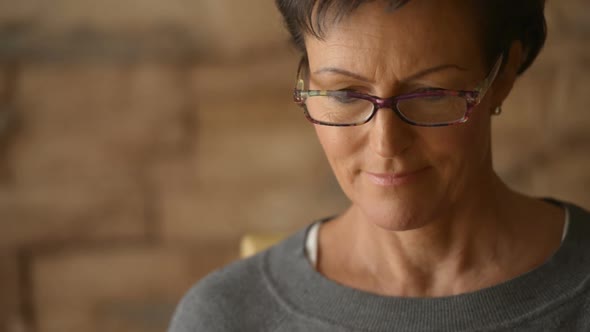 Face of Happy Mature Beautiful Woman Thinking While Drinking Coffee