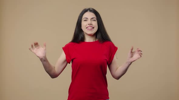 Portrait of a Model with Natural Beauty Looking at Camera with Excitement Then Celebrating Her