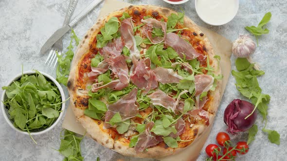 Pizza with Prosciutto and Arugula, Served with Fresh Ingredients on Sides