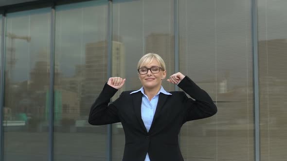 Successful Business Lady Making Winner Gesture Outdoors Office Building, Freedom