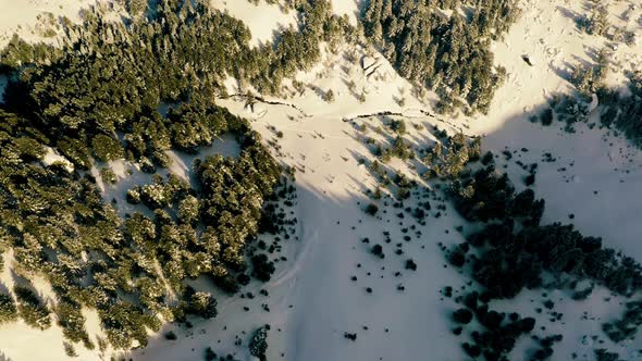 Flying Over Snowy Mountains in the Winter