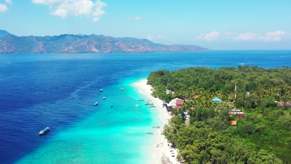 Aerial above landscape of idyllic seashore beach time by transparent sea and white sand background o