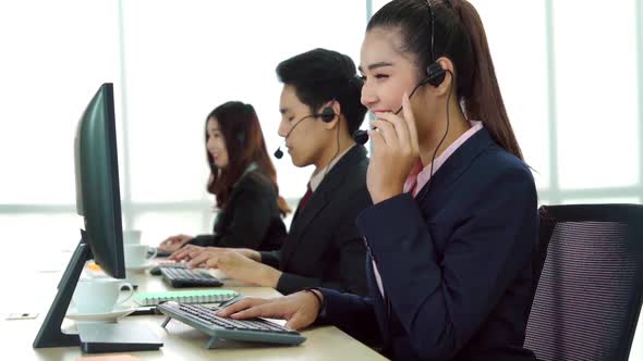 Business People Wearing Headset Working in Office