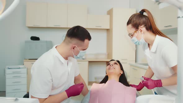 The Dentist Together with the Assistant Examine the Patient in the Dental Clinic