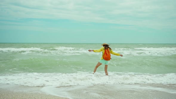 Panoramic View Beautiful Ocean Beach with Waves and Cloudy Sky Rear View Woman in Hat and Summer