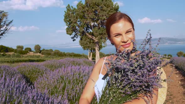 Woman Smelling Lavender