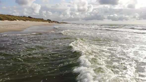 AERIAL: Flying very low over crashing waves