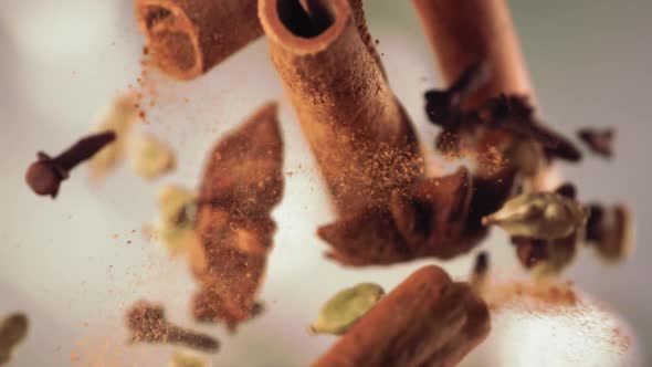 Clash of Flying Spices and Cinnamon Stick Cracking in Slow Motion