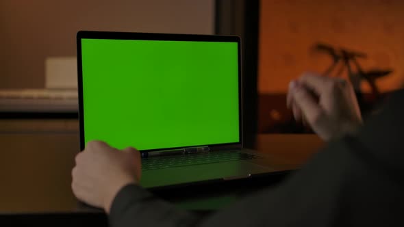 Faceless Man Waving Hand As Greeting at Online Call Via Laptop with Chromakey