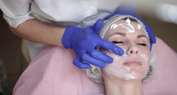 Close Up Top Shot of Pretty Young Lady Receiving Skin Treatment at Beautician