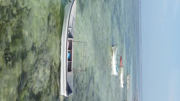 Tanzania Vertical Video  Boat Boats in the Ocean Near the Coast of Zanzibar Aerial View