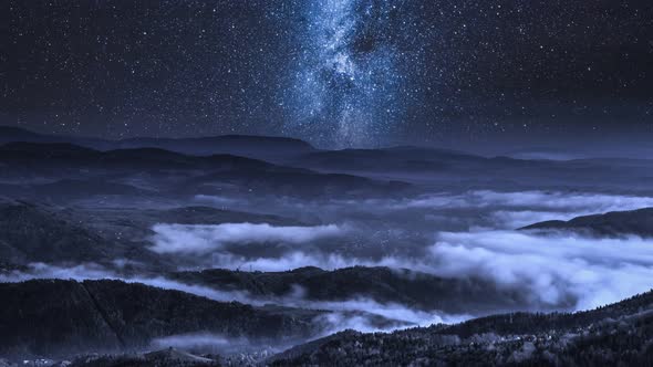 Milky way over flowing clouds in the Tatra Mountains, Poland