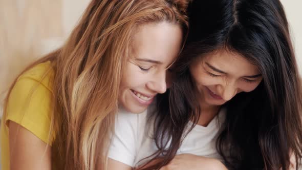 Happy Pregnant Asian Korean Woman with Friend Talking and Laughing While Celebrating Baby Shower at