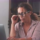 Unhealthy stressed businesswoman taking off eyeglasses, rubbing eyelids, suffering from dry eyes - VideoHive Item for Sale