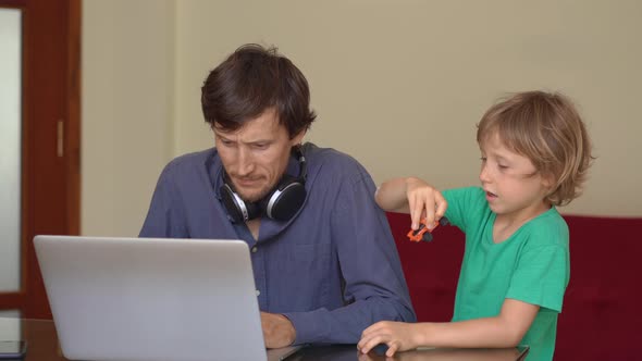 During Quarantine Man Is Trying To Work Remotely From Home, but His Son Disturbes Him, Children 