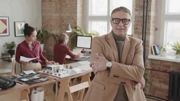 Portrait Of Senior Male Architect At Workplace