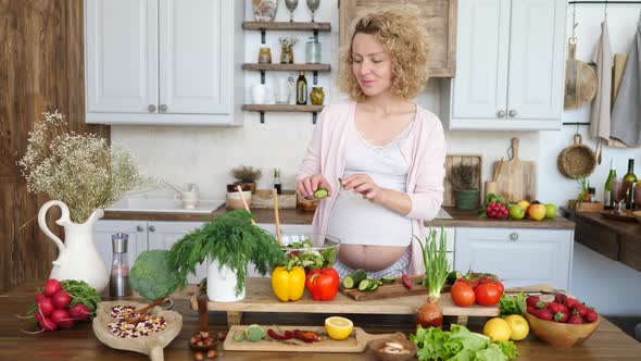 Healthy Diet Of Pregnant Woman Cooking Salad With Fresh Vegetables And Greens