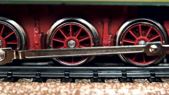 Vintage Model Electric Train on the Rails. Low Angle View.