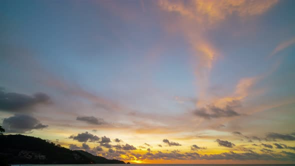 Amazing sunrise clouds over sea Timelapse Sunrise Burning colorful color sky and dark clouds