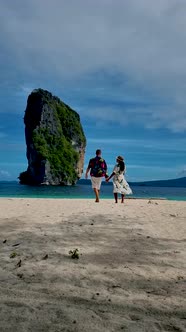 Koh Poda Krabi Thailand Asian Woman and European Men Walking on the Tropical Beach of Koh Poda