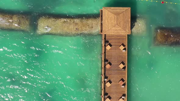 Aerial View From Drone on Caribbean Sea with Wooden Pier