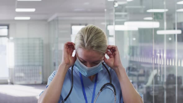 Portrait of female doctor wearing face mask in hospital